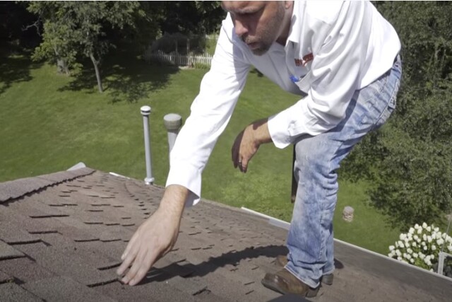 Roof worker checking on roof